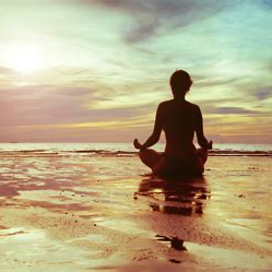 Harmony between Mind, Body, and Nature: A serene image of a person meditating or practicing yoga in a natural setting, perhaps with hands in a mudra position, emphasizing the connection between the mind, body, and nature